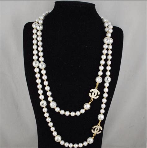 chanel logo jewelry necklace|Chanel logo necklace with pearls.